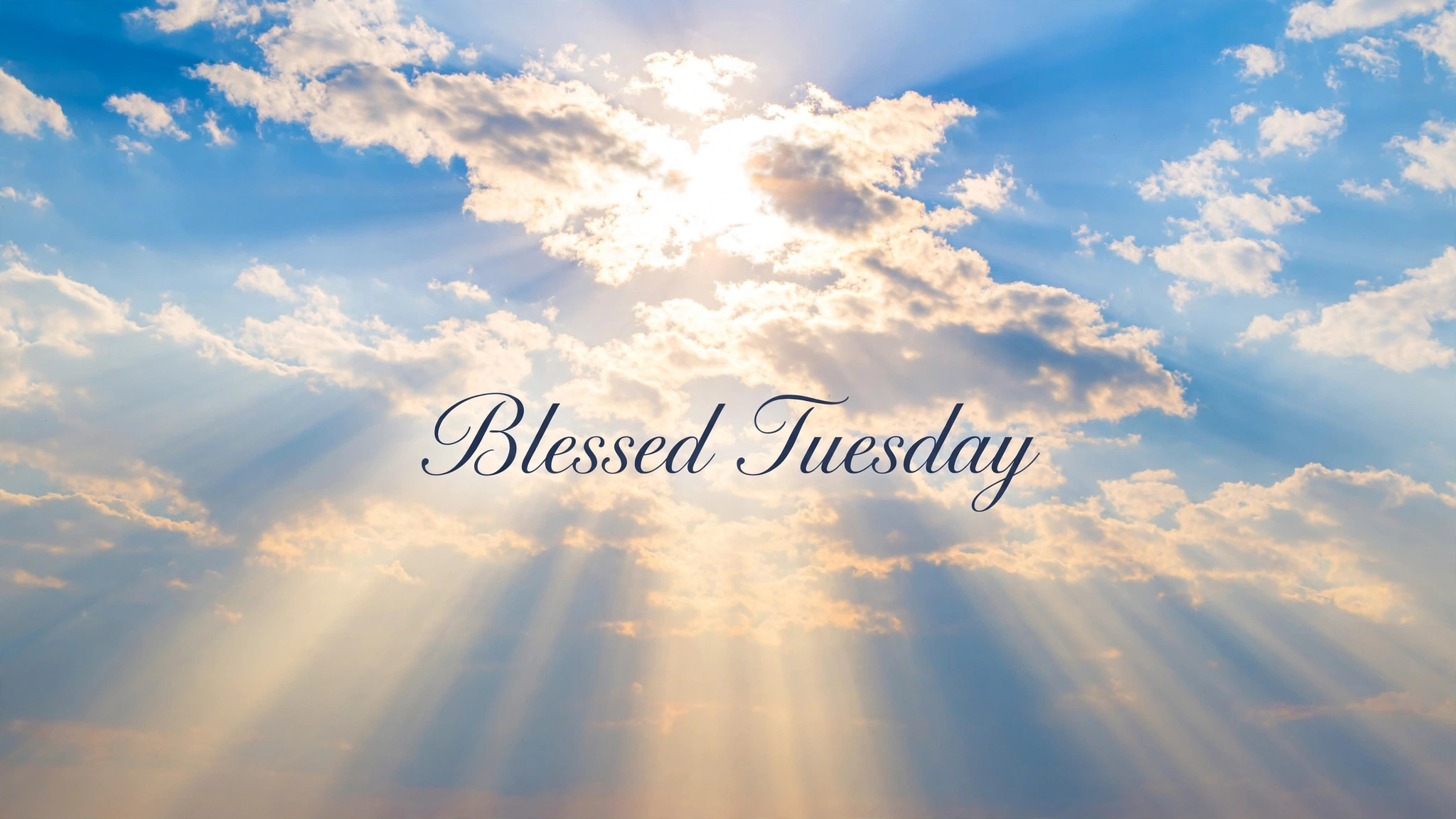 Blessed Tuesday image — sunshine bursting through bright clouds